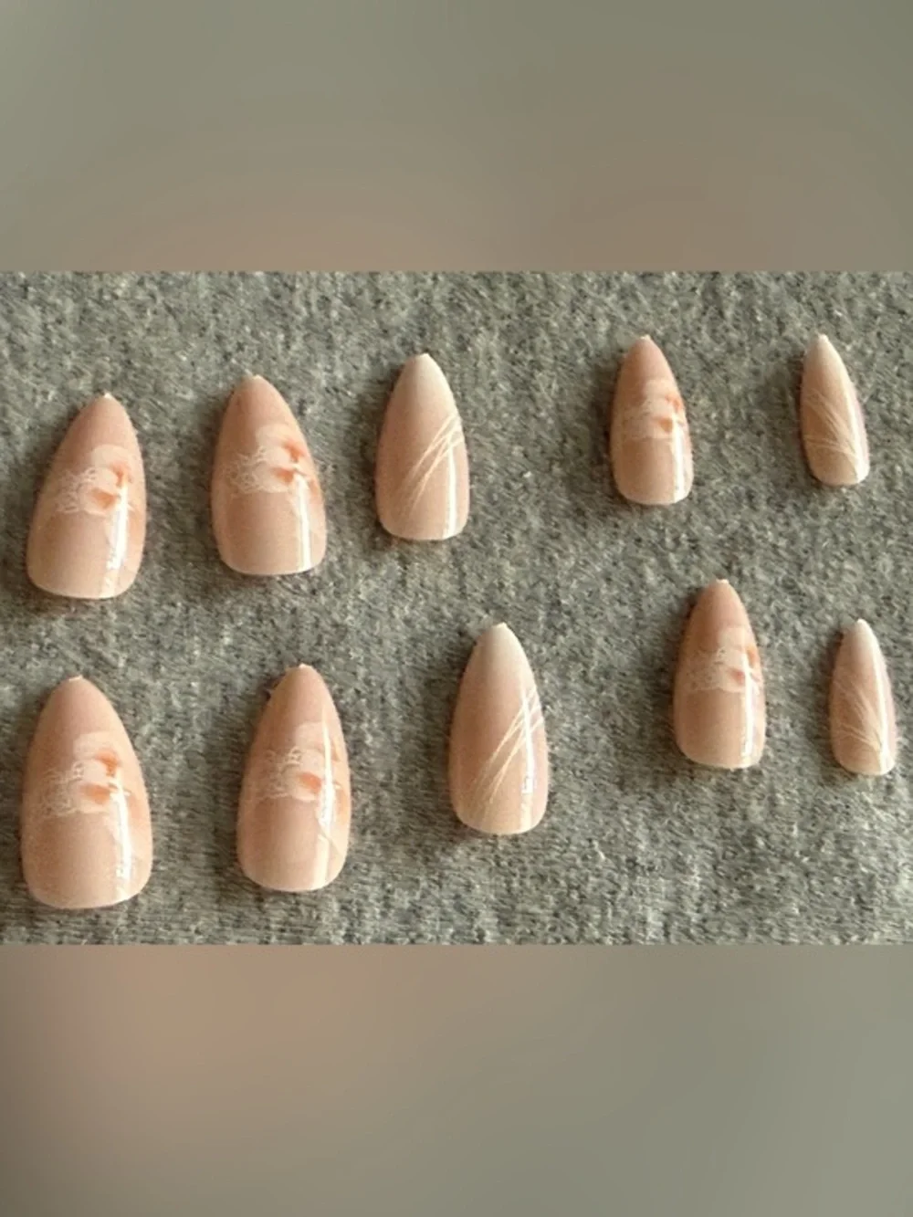 Peach Nude Press-On Stiletto Nails with Subtle White Floral Accent